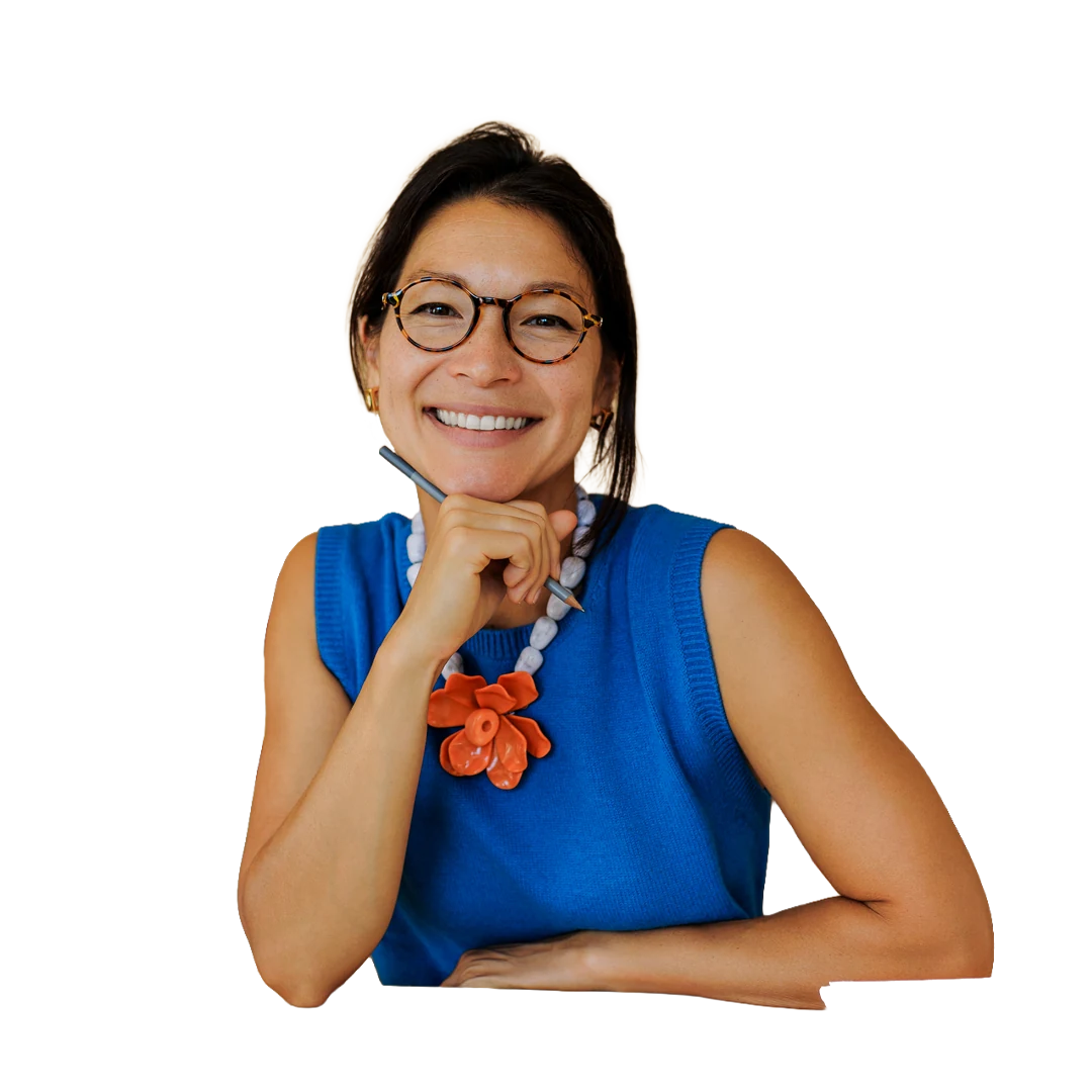 A teacher smiling in her classroom